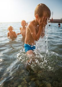 Children swimming in the sun hummingbird homeopathy for sunburn and dehydration